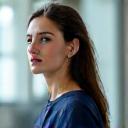 Sarah, 45, confidently presenting at a business meeting, symbolizing her improved stress management and mental clarity.