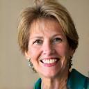 Smiling woman, 'Sarah L., Marketing Director'